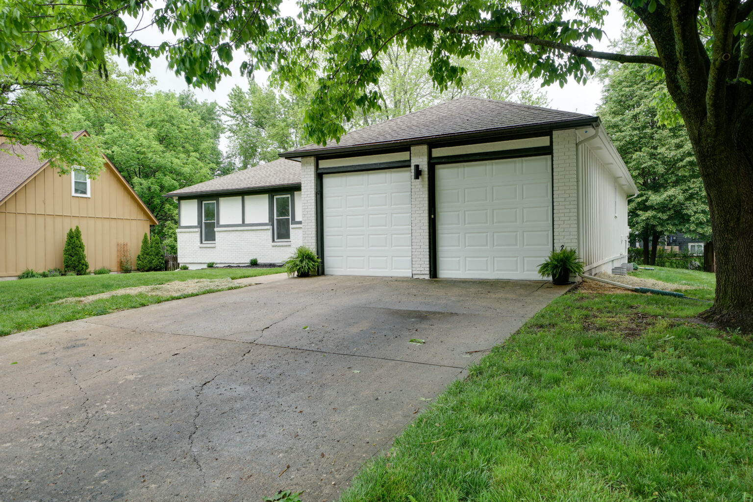 a garage with white walls and doors